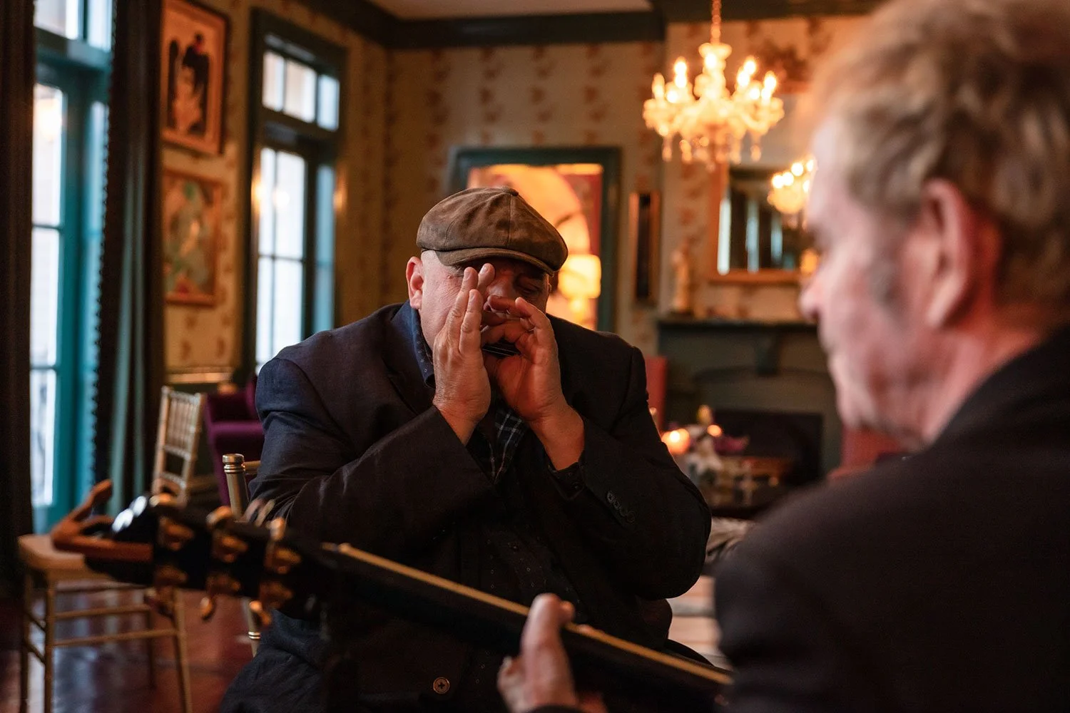 Harmonica player performing in the Blues Room at the Big Muddy Inn